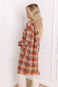 Believe us when we say our pretty rust colored 'Central Park Perks' dress is a fall staple with its lightweight but warm material, black and white plaid print, button down front with a collared neckline, long loose sleeves with button closure cuffs, two accent chest pockets with flap closures, and relaxed silhouette that falls into a straight knee-length hemline! Measurements S : Bust 42", Hip 44", Length 36.5", Sleeve Length 28", Waist 42". M : Bust 44", Hip 46", Length 37", Sleeve Length 28.5" Fall Staples, Accent Chest, Loose Sleeves, Black And White Plaid, Plaid Print, Plaid Dress, White Plaid, Central Park, Knee Length