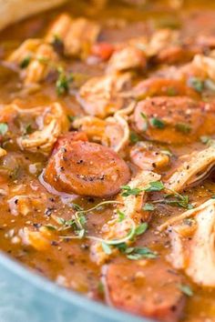 a bowl filled with chicken and sausage soup