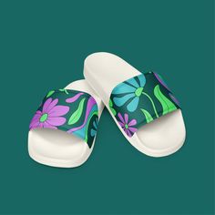 Step into comfort and style with these women's slides, perfect for the Phish festival or any casual occasion. Featuring a vibrant retro floral pattern in mondegreen colors, these slides are designed to offer both comfort and a touch of whimsy. Ideal for Phish fans who want to showcase their style while enjoying their favorite music. Lightweight and versatile, these slides are a must-have for any festival-goer or anyone who loves unique, eye-catching footwear. * Cushioned and durable faux leather Multicolor Slip-on Slides For Summer, Comfortable Green Slide Slippers, Multicolor Open Toe Slippers For Spring, Casual Green Slip-on Slides, Comfortable Green Slip-on Sandals, Green Comfortable Flat Flip Flops, Comfortable Green Flat Flip Flops, White Tropical Style Flip Flops For Spring, White Tropical Flip Flops For Spring