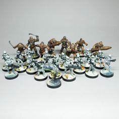 a group of small toy soldiers on white bases