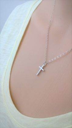 Similar items: ALLDANAE.etsy.com Please read my shop policies before ordering: https://www.etsy.com/shop/AllDanae#policies A small, simple cross necklace in all .925 sterling silver materials. Not including the loop, the cross measures approximately 1/2 inch high, and 3/8 inch wide (about 16mm X 9mm). The cross is small and understated, yet solid and very study. The smooth, unadorned silver goes effortlessly with whatever you are wearing. Your necklace can be made long or short. Choose your pref Everyday Silver Cross Pendant Necklace, Simple Everyday Cross Pendant Necklace, Minimalist Silver Cross Necklace, Simple Everyday Cross Necklace, Simple Sterling Silver Cross Pendant Necklace, Minimalist Sterling Silver Cross Necklace, Everyday Sterling Silver Crucifix Necklace, Simple Sterling Silver Cross Pendant Jewelry, Simple Sterling Silver Cross Pendant