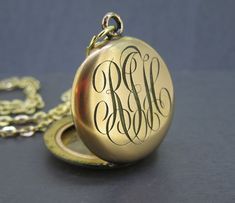 Wonderful small antique locket monogrammed on the front, looks like RJH .  Has age related wear and patina, a ding on the back.  Has the original contents inside.  Opens and closes with a snap.  Comes with a new 18" gold plated stainless steel chain necklace. Visit Ribbons Edge for more great pieces of vintage and antique jewelry!  All items added to your cart at Ribbons Edge will automatically combine shipping. To stay up to date with my newest offerings, follow me on IG @ RibbonsEdge Vintage Personalized Antique Gold Jewelry, Vintage Yellow Gold Personalized Jewelry Gift, Vintage Yellow Gold Jewelry For Personalized Gift, Vintage Gold Jewelry For Personalized Gift, Vintage Round Necklaces For Personalized Gifts, Vintage Pendant Jewelry For Personalized Gift, Vintage Round Pendant Jewelry For Personalized Gift, Antique Personalized Locket Necklace For Anniversary, Antique Style Personalized Medallion Necklace