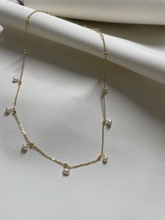 This necklace is handcrafted in brass with an elegant touch with the precious pearl charm attached. It's so minimalist but sophisticated, elegant but classy, simple but unique! It can match almost everything in your closet! //Materials// ✔️ pearl  ✔️ Chain, brass //Necklace Length// 18"  //Special Notes// **Feel free to ask me anything if you have concerns ! Fresh water pearl Dainty Gold-plated Charm Necklace With Pearl Pendant, Dainty Pearl Necklace For Everyday, Gold 14k Everyday Pearl Necklace, Everyday 14k Gold-filled Yellow Gold Pearl Necklace, Everyday Yellow Gold-plated Pearl Necklace, Everyday Gold Pearl Necklace In 14k Gold, Everyday 14k Yellow Gold Filled Pearl Necklace, Everyday 14k Gold Pearl Necklace In Gold, Delicate Pearl Chain Charm Necklace For Everyday