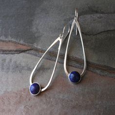 Lapis Lazuli teardrop dangle earrings. 8mm deep blue lapis set in sterling silver on handmade sterling silver teardrops. The teardrops swing from solid sterling silver ear wires. These earrings are 2 1/4 inches long including the ear wires. 5/8 inches at the widest part of the teardrop. For more Womens Silver Jewelry, Lapis Earrings, Lapis Lazuli Gemstone, Teardrop Dangle Earrings, Silver Jewelry Handmade, Silver Earrings Dangle, Earrings Dangle, Minimalist Earrings, Turquoise Jewelry