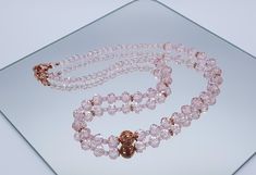 An Elegant Necklace and Earrings made with Austrian Crystal (10 & 6mm) beads. The Round 11mm Bead creates a centrepiece to really finish the look of the necklace. All findings are plated with 14K Rose Gold, Clasps encrusted with Zirconia crystals. Necklace length: 56cm/22in Beautiful and attractive necklace make you charmer and elegant. Wonderful gift for you and your female friends. All of my jewellery is handmade, by me.  Every item is made personally with each one taking several hours of pain Elegant Rose Gold Beaded Necklace For Gifts, Party Rose Gold Beaded Jewelry, Adjustable Rose Gold Necklace With Round Beads, Elegant Rose Gold Necklace With Round Beads, Elegant Rose Gold Jewelry With Faceted Beads, Elegant Adjustable Pink Gold Necklace, Elegant Pink Gold Adjustable Necklace, Rose Gold Single Strand Necklace With Round Beads, Formal Rose Gold Jewelry With Round Beads