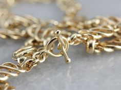 This long vintage chain is crafted of high karat yellow gold, woven links create a stylized Celtic knot motif along the chest. Wear this as a simple, elegant necklace, or layer it with other pieces for a wonderful, opulent look! Metal: 18K Yellow Gold Width of Chain: 5.7 mm Length of Chain: 30 inches Marks: "750 GEORG JENSEN" Stamped on the clasp Luxury Brass Jewelry With Gold Chain, Luxury Traditional Gold Chain Necklace, Luxury Traditional Jewelry With Complimentary Chain, Luxury Rectangular Gold Chain Jewelry, Luxury Elegant Wheat Chain Jewelry, Cheap Yellow Chain Jewelry, Luxury Gold Chain For Jewelry Making, Luxury Elegant Wheat Chain Necklace, Luxury Antique Yellow Gold Chain Necklace