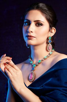 Elegantly blending classic and contemporary styles, this necklace set exudes a timeless and regal presence that is sure to capture attention. Perfect for any special occasion, its combination of traditional charm and modern elegance makes it the perfect accessory to elevate your ensemble. Finish: 22KT Gold Plating Material: Silver, Copper Alloy, Polki, Crystals Color: Multicolored Size: Free Size, Adjustable Closure Type: Draw String Box Contains: 1 Necklace, 1 Pair Earrings Elegant Bridal Necklace With Detachable Pendant, Elegant Bridal Necklace With Detachable Pendant For Wedding, Elegant Multicolor Jeweled Necklaces, Hand Set Jewelry Sets For Reception, Elegant Multicolor Necklaces For Formal Occasions, Elegant Jeweled Bridal Necklace For Festive Occasions, Elegant Bridal Necklace With Jewels For Festive Occasions, Elegant Wedding Jewelry Sets With Detachable Pendant, Festive Elegant Kundan Necklace With Jewels