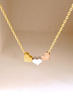 "Beautiful simple and everyday necklace~ Please write a note your initial \"note to seller box\" when you check out if you choose initial. DESCRIPTION: - This listing is for the HEART necklace. / 3 mini heart size 5mm - 16K gold, rose gold, silver over brass chain and lobster clasp - Handcrafted in the USA and beautifully packaged for you. LENGTHS: about 16 inch" Valentine Gifts For Girls, Tiny Heart Necklace, Antler Necklace, Girl Necklace, Gift For Best Friend, Personalized Mother's Day Gifts, Gift Valentine, Birthday Gifts For Best Friend, Graduation Gifts For Her