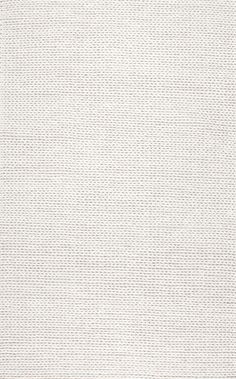 a white rug with small squares on it