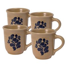 four coffee mugs with blue paw prints on the front and back of each cup