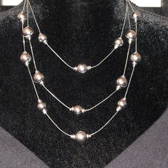 Dillard’s Multiple Silver Beads Necklace Elegant Round Beads Chain Necklace For Parties, Elegant Adjustable Beaded Necklaces, Elegant Adjustable Beaded Necklace, Elegant Metal Beaded Jewelry With Large Beads, Silver Pearl Necklace With Faceted Beads, Elegant Large Metal Bead Jewelry, Elegant Metal Beaded Jewelry, Elegant Metal Chain Necklace With Dangling Beads, Silver Dangling Beads For Party