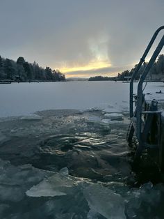 an icy lake with ice on the water