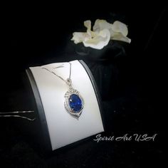 "Large Blue Sapphire Jewelry High Quality unique Artisan design full sterling silver made Gorgeous Luxury Gemstone Dainty Necklace best gift for yourself & you loved her. ◆◆Pendant Main stone:18*13mm Created Blue Sapphire Pendant Height ( include bail) : 41mm Pendant Holder (bezel & Bail) : White Gold Coated 925 Sterling Silver Accent Stone: Sim Diamond ◆◆ Necklace chain : Platinum coated 925 sterling silver Box Chain with length option from 16\" ~20\". The model wearing the default size Blue Sapphire Jewelry, Crown Pendant, Blue Sapphire Pendant, Blue Sapphire Gemstone, Diamond Crown, Peridot Necklace, Blue Sapphire Diamond, Garnet Jewelry, Sapphire Pendant