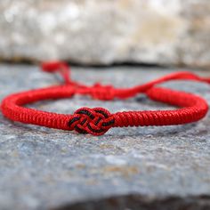 The Tibetan braided Lucky Knot Bracelet is a beautifully crafted accessory Handmade with love and care using the ancient art of Tibetan knot techniques. ✅ KNOTS : Each knot is meticulously tied, resulting in a stunning pattern that symbolizes the interconnectedness of life. The intricate knots create a mesmerizing visual spectacle, capturing the attention of anyone who beholds it. ✅ ADJUSTABLE: Its size is adjustable between 16 -24 cm, and fits standard Unisex sizes, if you need a smaller size i Traditional Adjustable Cord Friendship Bracelet, Handmade Symbolic Braided Bracelets As Gift, Traditional Braided Friendship Bracelets As Gifts, Red Braided Bohemian Jewelry, Red Macrame Braided Bracelet As Gift, Red Macrame Braided Bracelet For Gift, Traditional Friendship Braided Bracelet With Sliding Knot, Red Braided Jewelry As A Gift, Red Braided Jewelry For Gifts