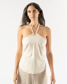 Baserange Mar Top in Undyed. Wild silk wrap top with a halter neck and open back. Ties at neck and waist. 100% Wild Silk Tosh is 6'0 and wearing the Small Adjustable Wash cold, hang dry Made in Turkey Baserange At any given time in our store at least one member of our team is wearing a Baserange piece. That’s because they deliver what they promise: clean silhouettes, comfortable support, and everyday underwear or basics. Baserange prioritizes clean production and high quality fabrics and has one Silk Wrap Top, Silk Wrap, Wrap Top, Sweater Sleeves, Halter Neck, Vintage Black, Childrens Clothes, Open Back, Quality Fabric