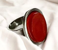 "Vintage ring made in Sterling silver featuring an orange stone (possibly carnelian) Dimensions: The top part of the ring measures approx. 1.8x2.2cm (0.71\"x0.87\"), the stone is 1.3x1.8cm (0.51\"x0.71\"). Size: 6 1/2 (US), 16.92mm Weight: 8.3 grams. In wonderful vintage conditions. ------------------------------------ * Thank you very much for visiting our Etsy store! All of our shipments are internationally tracked and require a signature upon receipt for your added security and peace of mind. We'll be delighted to combine or refund any excess postage for multiple items bought. If you have any questions, please do not hesitate to contact me." Orange Stone, Vintage Ring, Rings Statement, Sterling Silver Ring, Vintage Rings, Etsy Store, Statement Rings, Silver Ring, Sterling Silver Rings