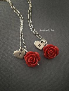 Red rose necklaces with hand stamped initial heart for best friends. Red rose and heart charm are on an 18'' stainless steel chain with lobster clasp. *This price is for 2 necklaces *Stainless steel chain *Stainless steel heart *15mm red rose *Handmade with love <3 Like Jmesjewelrybox on Facebook for updates on new jewelry, upcoming sales and giveaways! Plus Facebook fans save 5% :D Find the coupon code on Jmesjewelrybox's cover photo https://www.facebook.com/Jmesjewelrybox Red Flower Charm Jewelry For Valentine's Day, Valentine's Day Initial Pendant Charms Jewelry, Personalized Dangle Charm Necklaces For Valentine's Day, Valentine's Day Stainless Steel Necklace, Valentine's Day Charm Necklace With Initial Pendant, Dainty Personalized Red Charm Necklaces, Valentine's Day Sterling Silver Rose Jewelry, Personalized Red Dangle Jewelry, Dainty Red Personalized Charm Necklaces