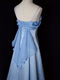 Step into timeless elegance with this Vintage Blue Satin Gown. Crafted from luxurious satin, this dress features delicate spaghetti straps that provide a graceful and feminine silhouette. The highlight of this gown is its unique winged back design, adding a touch of whimsy and sophistication. Perfect for formal occasions, evening events, or any special celebration, this elegant dress ensures you'll make a stunning entrance. The vintage blue hue adds a classic touch, making it a versatile additio Blue Long Prom Dresses, Hot Prom Dress, Long Party Dress, Prom Dress Inspiration, Pretty Prom Dresses, A Line Prom Dresses, Black Prom Dresses, Prom Dresses Lace, Hoco Dresses