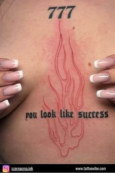 a woman's back with tattoos on it that says, you look like success