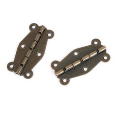 two antique brass plated metal hinges on a white background