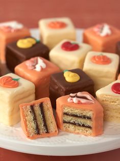 a white plate topped with lots of different types of cakes