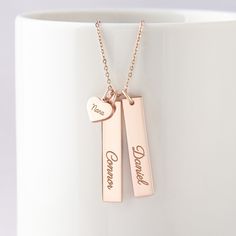 "This beautiful grandma necklace is engraved with your children's names on each charm. It's a perfect gift for your loved one with up to 5 personalized charms. PRODUCT INFO * Material: Solid 925 Sterling Silver * Dimensions: Bar charm measures ~ 1 1/4\" x 1/4\" (32 x 6.5mm). Heart charm measures ~3/8\"x5/16\" (9.5 x 8.2mm) * Word limits: 1 name/charm * By default, silver charm comes with BLACK engraving and gold-plated charm comes with CLEAR engraving HOW TO ORDER * Select your preferred finishi Personalized Rose Gold Name Necklace, Personalized Rose Gold Necklaces For Mother's Day, Personalized Rose Gold Necklace For Mother's Day, Rose Gold Nameplate Charm Necklace For Anniversary, Customizable Rose Gold Charm Necklace For Gift, Customizable Rose Gold Charm Necklace As Gift, Personalized Birthstone Name Necklace For Mother's Day, Mother's Day Nameplate Birthstone Necklace, Nameplate Necklace For Father's Day