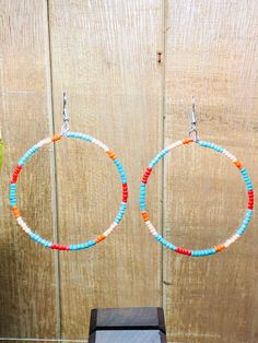 "These adorable southwestern beaded hoop earrings are hand made in the USA.  Add a little bit of fun to your wardrobe ladies!  These earrings are the perfect accessory for a night out on the town or with a pair of your favorite jeans.  This earring is a great gift for any woman.  The earring is length 2 1/2\" and 2 1/4\" wide" Adjustable Hoop Beaded Earrings With Dangling Beads, Adjustable Hoop Earrings With Tiny Beads, Hoop Earrings With Tiny Beads, Nickel-free Adjustable Hoop Beaded Earrings, Bohemian Small Hoop Beaded Earrings With Ear Wire, Bohemian Beaded Small Hoop Earrings With Ear Wire, Nickel Free Small Hoop Beaded Earrings For Festivals, Adjustable Small Hoop Earrings With Dangling Beads, Adjustable Circular Beaded Earrings With Tiny Beads