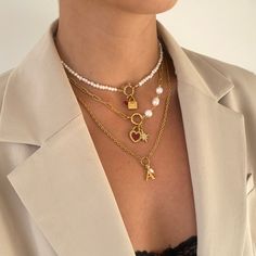 Our Allegra Necklace features a textured cable chain with O-ring to center with initial and mini freshwater pearl charms. Elegantly designed, this necklace makes a special personalised gift for a loved one or addition to your own collection. 18k gold plated stainless steel + freshwater pearls Length: 18" + 2" extender (can be made shorter, please leave desired length in 'order notes' section at checkout) Tarnish and sweat resistant Hypoallergenic no green skin 1 year warranty Trendy Metal Pearl Necklace For Gift, Trendy Everyday Pearl Charm Necklaces, Trendy Pearl Pendant Chain Necklace As Gift, Trendy Everyday Pearl Charm Necklace, Trendy Chain Necklace With Pearl Pendant For Gift, Trendy Gold Pearl Charm Necklaces, Trendy Pearl Charm Chain Necklace Gift, Metal Charm Necklace With Pearl Charm For Gifts, Trendy Pearl Necklace As A Gift