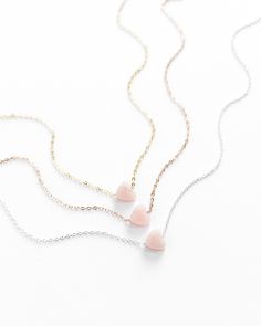 "𝗘𝗮𝘀𝘆 𝗧𝗼 𝗦𝘁𝘆𝗹𝗲, 𝗠𝗮𝗱𝗲 𝗧𝗼 𝗟𝗮𝘀𝘁 A perfect Valentine's Day gift, our dainty rose quartz gemstone necklaces are easy to layer and ready to be worn on repeat! Created to last a lifetime, these necklaces will remain evergreen even as the years and trends come and go. 𝗠𝗮𝘁𝗲𝗿𝗶𝗮𝗹𝘀 𝗪𝗲 𝗨𝘀𝗲 This necklace is made entirely with sturdy 14k yellow gold filled or sterling silver pieces and a genuine gemstone pendant. It is safe to wear in the shower, but we recommend avoiding prolonged exposure to chemicals like chlorine to keep your necklace like new! Our gemstones are not dyed or artificially colored in any way. The stones and their colors are completely genuine! 𝗟𝗲𝗻𝗴𝘁𝗵 𝗢𝗽𝘁𝗶𝗼𝗻𝘀 We have lengths between 14\" - 20\" available! Generally, we recommend 14\" length Minimalist Gemstone Jewelry For Valentine's Day, Dainty Rose Gold Heart Beads Necklace, Dainty Rose Quartz Jewelry In Rose Gold, Minimalist Rose Quartz Jewelry For Gifts, Minimalist Rose Quartz Jewelry As Gift, Minimalist Rose Quartz Jewelry Gift, Dainty Rose Quartz Jewelry For Gifts, Dainty Rose Quartz Gemstone Jewelry, Minimalist Gemstone Necklace For Valentine's Day