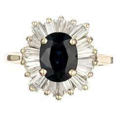 an oval black and white diamond ring