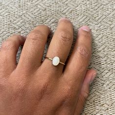 Mother of Pearl : symbolizes good luck and prosperity. Metal: Sterling Silver or 14K Gold Filled Stone: Mother of Pearl cabochon 8 x 6 mm Oval Gold Opal Ring In 14k Gold, Gold 14k Opal Ring As Gift, 14k Gold Opal Ring For Gift, 14k Gold Filled Oval Minimalist Jewelry, Minimalist 14k Gold Filled Oval Jewelry, Adjustable White 14k Gold Jewelry, Oval 14k Gold-filled Jewelry For Anniversary, Adjustable Oval Opal Ring Minimalist Style, Minimalist Oval Cabochon Opal Ring For Anniversary