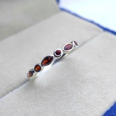 Tiny delicate vintage art deco garnet wedding ring, Small & dainty sterling silver marquise cut garnet womens wedding band, Garnet jewelry ------------------------------------------------------------------------------------------------------------------------------------------------------------------------------------------------------------- Garnet Wedding Ring ◈ Item Details ◈ Metal : Sterling Silver Metal Purity: 925 Parts Per 1000 Style : Vintage Ring Main Stone : Natural Garnet  Stone Size : 2x4 mm Stone Shape : Marquise  Other Stone : Garnet  Occasion : Party , Anniversary , Wedding Personalization : Possible 925 sterling silver with silver/white/yellow/rose gold plated. Sent in a very elegant wedding ring box, ready for one special lady. Customization is always welcome and please fe Formal Sterling Silver Stackable Jewelry, Elegant Sterling Silver Stackable Rings With Gemstone, Elegant Red Garnet Stackable Rings, Fine Jewelry Amber Birthstone, Amber Birthstone Fine Jewelry, Fine Amber Birthstone Jewelry, Elegant Garnet Gemstone Stackable Rings, Elegant Garnet Stackable Rings, Elegant Stackable Garnet Gemstone Rings