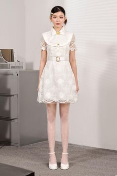 This figure-flattering dress features an intricate lace design and a comfortable fit for all day wear. With short sleeves and an A-line silhouette, you'll make a statement in this eye-catching mini dress! Fitted White Mini Dress With Cap Sleeves, White Fitted Mini Dress With Cap Sleeves, Fitted A-line Lace Dress With Lace Collar, Feminine Lace Patchwork Mini Dress With Short Sleeves, Feminine Short Sleeve Mini Dress With Lace Patchwork, Feminine Mini Dress With Lace Patchwork, A-line Mini Dress With Scalloped Lace, Short Sleeve Dress With Lace Collar, Fit And Flare Knee-length Scalloped Lace Dress