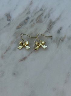 -gold plated 14k Gold Bow Jewelry, Dainty Gold Jewelry With Ribbon, Elegant Gold Jewelry With Butterfly Knot, Gold Earrings With Decorative Bow As Gift, Chic Gold Earrings With Decorative Bow, Gold Earrings With Decorative Bow For Formal Occasions, Chic Gold Earrings With Bow, Elegant Gold Earrings With Bow Tie Detail, Gold Dainty Bow Jewelry