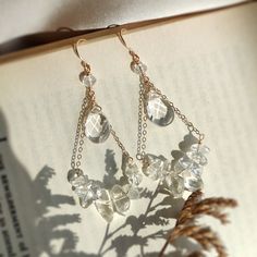 Clear Quartz Crystal Chandelier Earrings in 14K gold filled • Handmade with natural clear quartz gemstones. Choices of 14K Gold filled & Sterling Silver • Drop length: 6 cm • Classy and elegant earrings. A cute treat for yourself and a lovely gift for her ✨ • These earrings won’t tarnish. Gold-filled and sterling silver are known for their lasting quality. They won't tarnish or turn color. • Hypoallergenic. You won’t have to worry about allergies from metal such as nickel. • Each pair will be pa Cristal Earring, Chip Jewelry, Quartz Gemstones, Crystal Chandelier Earrings, Classy And Elegant, Earring Card, Earring Cards, Craft Paper, Clear Quartz Crystal