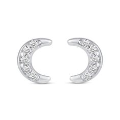 She'll love the celestial theme of this charming diamond three-pair stud earrings set. Crafted in sterling silver, this set features dainty diamond-touched earrings - one pair each of curved lightning bolts, crescent moons and four-pointed stars. Captivating with 1/10 ct. t.w. of diamonds and a bright polished shine, these earrings secure with push-screw backs. Celestial Cubic Zirconia Jewelry In Diamond White, Celestial Style Jewelry With Brilliant Cut, Formal White Gold Crescent-shaped Pendant, Formal Crescent White Gold Jewelry, Celestial Jewelry With Round Cut Diamond Accents, Celestial Style Jewelry With Round Cut Diamond Accents, White Crescent Diamond Jewelry, Celestial White Gold Jewelry With Brilliant Cut, Celestial Earrings With Diamond Accents For Anniversary