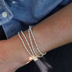 Whether worn alone for a touch of understated luxury or stacked with other bracelets for a bold statement, these Ball Bead Bracelets add a touch of glamour to any outfit, for any occasion. Made to be worn in the pool, shower, ocean, or wherever your bohemian adventures take you. Waterproof | Tarnish Free | Hypoallergenic Classic 3mm beads Options: 14K gold filled, Sterling Silver, or Two Tone High Performance Elastic Made in Miami Elegant Silver Stackable Wrap Bracelet, Elegant Stackable Stretch Bracelet For Party, Minimalist Beaded Jewelry For Party, Hand-strung Party Jewelry, Elegant Beaded Flexible Jewelry, Hand-strung Bracelets For Parties, Elegant Flexible Beaded Jewelry, Gold Stretch Bracelet With Faceted Beads For Party, Gold Stretch Bracelet With Faceted Beads