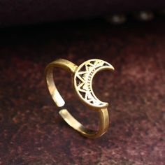 Gold Half Moon ring, Crescent Moon Ring, Mandala Moon Ring, Stacking Ring, Luna Ring, Minimalist Ring, Dainty Ring, Adjustable Boho Ring Metal:- Brass ✦ Our rings are made of high-quality Brass metal and are carefully crafted by hand in our family workshop. The brass metal will develop a nice antique color over time. So, I suggest cleaning it once in a while for getting back to the shiny original color. You can use natural ingredients like lemon or vinegar with water to clean it. Also, apply a thin coat of transparent nail paint/nail enamel on the ring's inner side to save it from being tarnished. ❥ You may request to return the products, 15 days after you received the items (Delivery Day). The buyer is responsible for the shipping costs for the return. (We may have slower production at ho Minimalist Adjustable Crescent Ring, Adjustable Moon Shaped Celestial Midi Rings, Adjustable Moon-shaped Celestial Midi Rings, Adjustable Celestial Moon Midi Rings, Adjustable Rings With Moon Charm, Bohemian Rings With Moon Charm For Gift, Adjustable Moon-shaped Midi Promise Rings, Bohemian Moon Phase Ring, Minimalist Adjustable Rings With Moon Charm