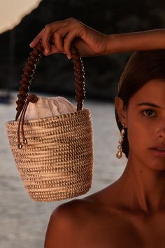 A luxe, take on the bag that started it all - our signature Lunchpail, now finished with an intricately hand-braided Napa Leather handle, from a centuries old Italian atelier, heralded for it’s world class quality and attention to details. Cesta baskets are handwoven by female artisans in Rwanda, Africa, using locally sourced, renewable resources. Each piece is hand finished in Italy with carefully chosen, sustainable materials. 6" W x 6.5" T x 6" D Leather: Camel Italian Nappa / Vegetable Tanne French Riviera Style, Rwanda Africa, Lunch Pail, Boho Bags, Gender Equality, Social Impact, Beach Photoshoot, Basket Bag, Women Artisans