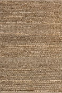 an area rug with different colors and patterns on it, including beiges and browns