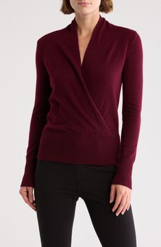 Embrace cozy elegance styling this cashmere sweater that features a surplice V-neckline. 24" length (size Small) Surplice V-neck Long sleeves 100% cashmere Dry clean Imported