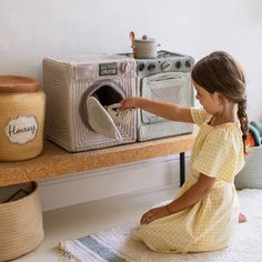 With the Washing Machine Play Basket by Lorena Canals, doing laundry has never been more fun! This 100% handcrafted textile washing machine play set is perfect for your little one who likes to imitate your chores around the house. The Washing Machine Play Basket by Lorena Canals comes with a Lorena Canals mini-rug and a mini-cushion shaped like a bottle of detergent. Size: 11.8'' x 13'' x 12'' Composition: 72 % polyester fibers from recycled PET bottles, 28 % cotton Certifications: ISO 9001, ISO Toy Washing Machine, Fairytale Lover, Detergent Bottles, Lorena Canals, Swinging Doors, Toy Basket, Honey Pot, Pet Bottle, Play Kitchen