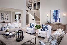 a living room filled with furniture and a spiral staircase