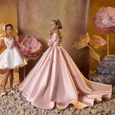 Introducing the DreamyVow Luxury Pink Satin Girl Dress! Made with high-quality satin and featuring a square collar and long sleeves, this dress is perfect for weddings, birthday parties, and any special occasion. Provide your child with the ultimate luxury and elegance with this stunning dress. Princess Style Long Sleeve Pageant Dress, Princess Style Long Sleeve Ball Gown For Pageant, Long Sleeve Princess Style First Communion Dress, Elegant Long Sleeve Princess Dress For First Communion, Pink Long Sleeve Satin Gown, Pink Satin Long Sleeve Gown, Pink Long-sleeved Satin Gown, Elegant Long Sleeve Ball Gown For Pageant, Princess Style Long Sleeve First Communion Dress