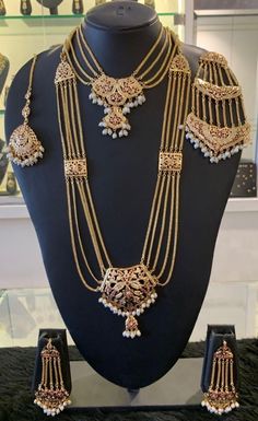 Bridal hydrabdi/punjabi style set. The set has a long necklace,a choker,matching earrings,maangtikka and jhoomar to go with it. The center pendant in sweet heart shape and comes with matching long but lightweight earrings. The earrings are jhoomar style. There are connecting Jaddau charms strung with the gold chains. The earrings can be paired with the necklace or can be worn by itself. It's a complete statement piece. Derived from the traditional jadau jewelry,it's a complete set for a bridal w Pakistani Gold Jewelry, Gold Set Design, Jadau Set, Etsy Jewelry Necklace, Punjabi Style, Unique Gold Jewelry Designs, Pakistani Bridal Jewelry, Bridal Pendant, Gold Jewels Design