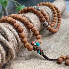 "This attractive and powerful Japa Mala is made with 108 Raktu seed beads that are hand stung in a nylon string with a fixed knot  📿Mala Beads, or Buddhist prayer beads, are a set of sacred rosary beads for chanting & counting mantras, meditation, prayer, yoga & reflection. Mala is a Sanskrit word meaning garland. The Tibetan word for mala is threngwa (Tibetan ཕྲེང་བ) . Seed malas are some of the most common malas used in Tibet and Nepal. Buddhist Prayer Beads are sometimes referred to as Japa Holistic Wooden Beaded Bracelets For Meditation, Spiritual Wooden Beads Mala For Festival, Bohemian Wooden Beads Mala For Festival, Bohemian Festival Mala With Wooden Beads, Holistic Mala With 108 Beads For Festival, Holistic Healing Mala With Wooden Beads, Holistic Wooden Beads Mala For Festivals, Round Beaded Bracelets For Meditation And Festivals, Traditional Beaded Necklaces For Meditation