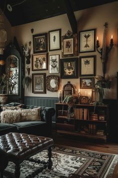 a living room filled with furniture and pictures on the wall