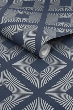 a blue and white wallpaper with an abstract design on the back side of it