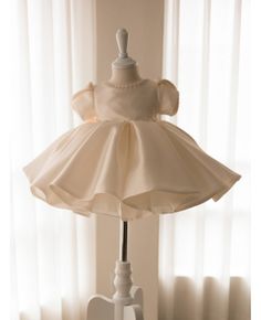 Get 10% off now! Buy elegant white ruffled satin ballgown toddler flower girl dress with pearls at cheap price online. Free stable shipping and pro custom service since 2009. Princess Style Satin Ball Gown For Pageants, Elegant Solid Color Princess Dress For Dress-up, Princess Style Satin First Communion Dress, Elegant Princess Dress With Ruffles For First Communion, Satin Princess Dress For Dress-up, Elegant Princess Dress With Pearl Embroidery For Baptism, Elegant Fitted Princess Dress, Satin Princess Dress With Satin Bow, Satin Ruffled Dress For Dress-up Occasions