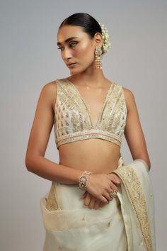 Editor's Note Embrace sheer sophistication with this organza sari set. This timeless ensemble is adorned with delicate embroidery, creating an ethereal charm that captures the essence of india's rich heritage. The intricate design and simplicity makes it a perfect choice for those who appreciate classic beauty. Wedding Blouse With Sheer Dupatta For Diwali, Designer Wear Organza Blouse Piece For Transitional Season, Traditional Organza Blouse For Festive Occasions, Transitional Organza Blouse Piece For Designer Wear, Festive Organza Blouse Piece For Transitional Season, Festive Transitional Organza Blouse Piece, Designer Organza Blouse With Cutdana, Designer Cutdana Organza Blouse, Festive Unstitched Organza Blouse Piece